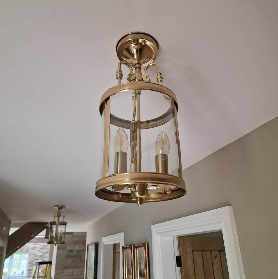 Brass hall lantern fitted to a hallway ceiling